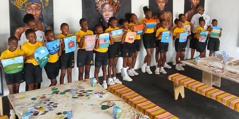 Students with paintings